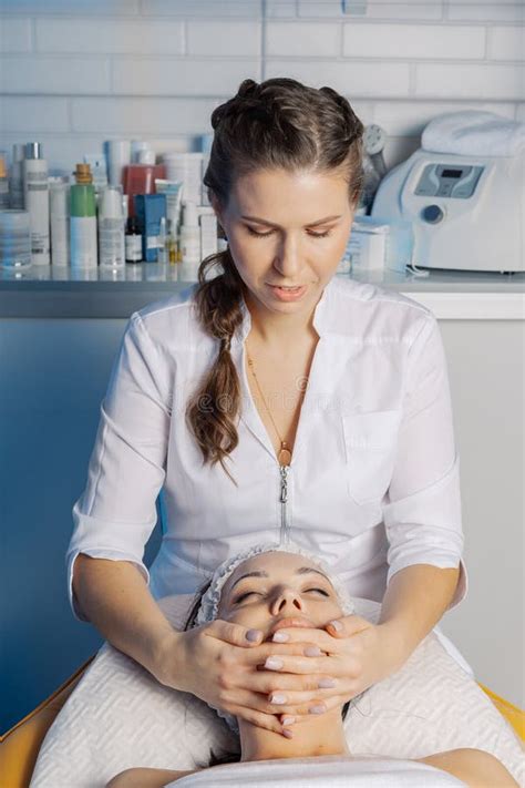 Professional Beautician Makes A Facial Massage To A Woman Stock Image Image Of Health Face