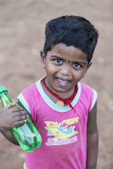 Portrait Of Unidentified Indian Poor Kid Boy Is Smiling Outddor In The