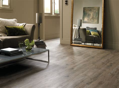 The living room leads to a den/home office, and it is the hardwood floors that unifies these two seemingly different rooms. Inspired vinyl plank flooring in Living Room Eclectic with ...