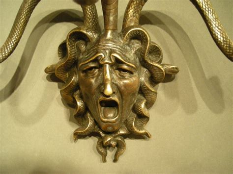 Maybe you would like to learn more about one of these? Pair of bronze Medusa wall decorations. at 1stdibs