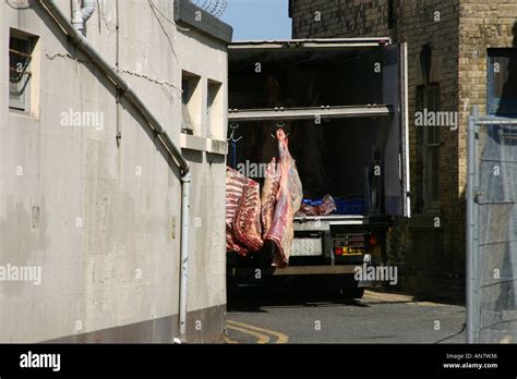 Sides Of Meat Hanging In A Butchers Delivery Van Stock Photo Alamy
