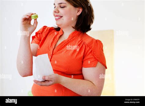 Woman Snacking Stock Photo Alamy