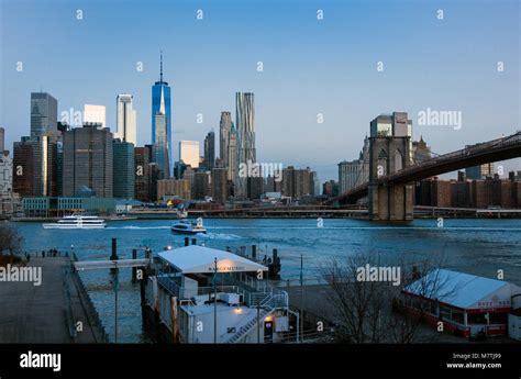 The Lower Manhattan Skyline Brooklyn Bridge And The East River Ferry