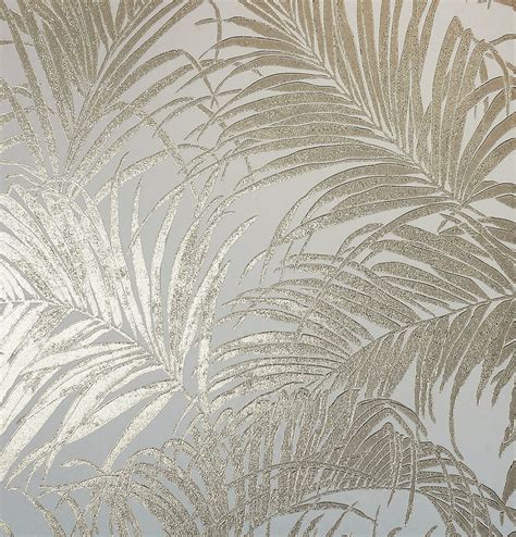 The stylish design features rose gold metallic safari animals including elephants, giraffes and zebras on a subtly patterned cream. Kiss Foil Palm Metallic Cream Gold 903201 Wallpaper ...