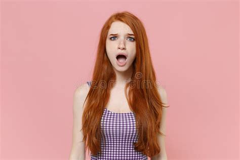 Shocked Irritated Young Redhead Woman Girl In Plaid Dress Posing On