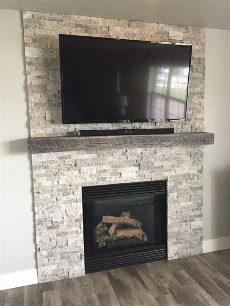 Silver Travertine Stacked Stone And A Reclaimed Jim Beam Mantel For