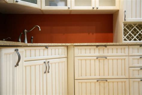 The beadboard cabinets complement the home's period. Beadboard cabinets picture | ImprovementCenter.com