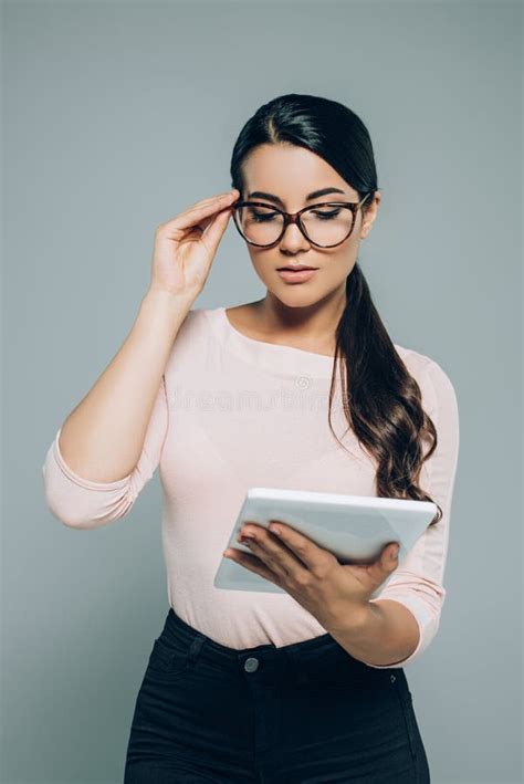 Portrait Of Brunette Woman In Eyeglasses Using Digital Tablet Stock Image Image Of Eyeglasses