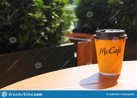 Mccafe Menu At Mcdonalds Restaurant Yellow Cup Of Coffee On A Table Outdoors With Yellow
