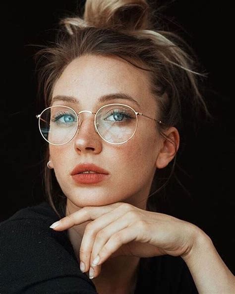 Blonde Lady In Spectacles And Black Top With Hand Under Her Chin Best Eyeglasses Online
