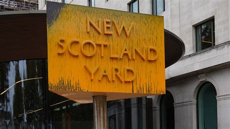 New Scotland Yard Sign Covered With Yellow Paint As Protesters Target