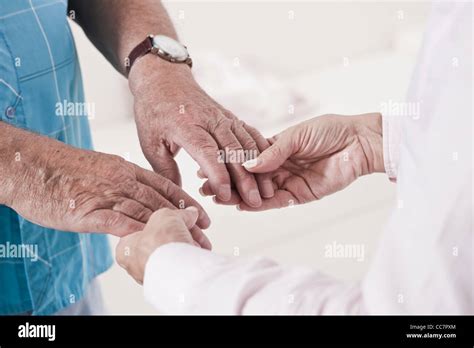 Close Up Of Caregiver Holding Patients Hands Stock Photo Alamy