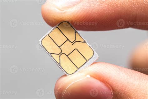 Is it possible to clone a sim card? Hand hold micro nano SIM card isolated Stock Photo