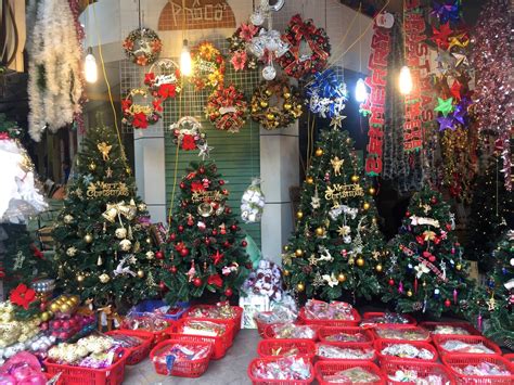 Christmas Trees And Other Decorations Are On Display In A Store Window