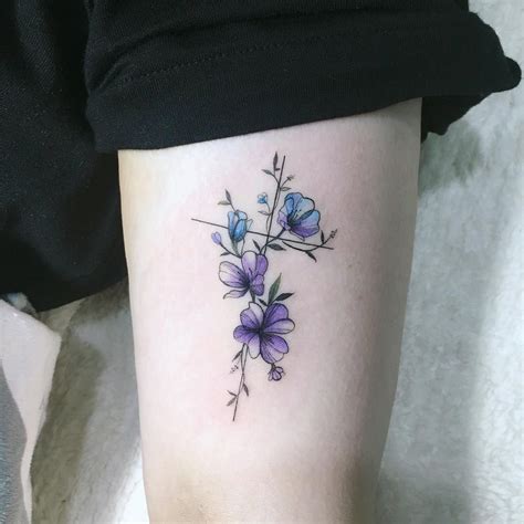 Well, jesus' body left the earth but he never did. cross and primrose on arm in 2020 | Flower tattoo, Flower ...