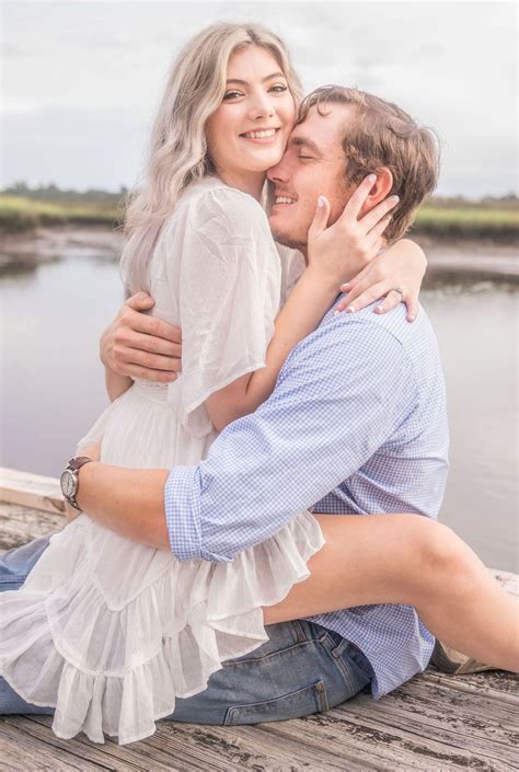 Engagement Picture Of Couple Cuddling On The Dock Georgia Wedding Photographer Kingsland