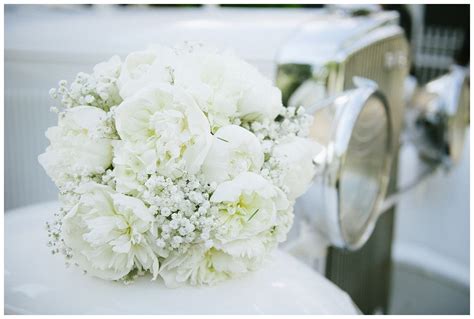 White Peony And Babys Breath Bouquet On Old Vintage Classic Car