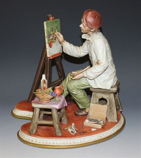 A Capodimonte Porcelain Figure Of An Artist Sitting At An Easel