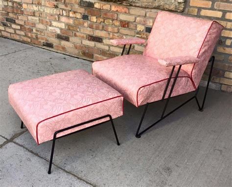 These chairs feature a round molded body with sculpted arms, four rod legs, and a pad feet on the ends. Wonderful pink Mid Century Modern armchair with ottoman # ...