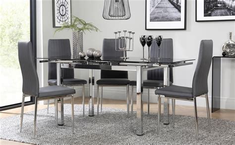 This table dining set contemporary, composed of 5 rooms, a modern and elegant design and is perfect for those looking to add a touch of style to their interior. Space Chrome & Black Glass Extending Dining Table with 6 ...