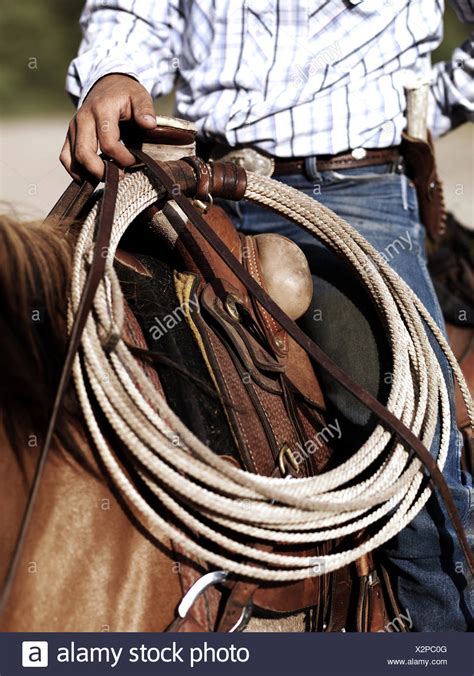 Cowboy On Horseback With Lasso High Resolution Stock Photography And