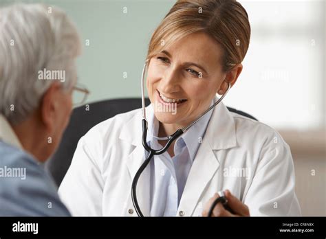 Doctor Taking Senior Mans Blood Pressure Close Up Stock Photo Alamy