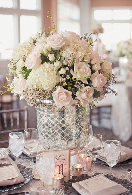 You don't need previous flower arranging or crafting experience to as you place flowers on the edges, adjust the stems to give the centerpiece a slightly rounded look. Glamorous White Rose Centerpiece | Wedding flower photos ...