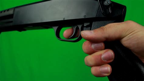 Putting Finger On A Trigger And Holding Shotgun Hd Free Stock Video Footage