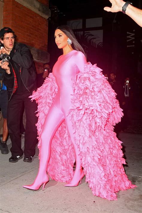 kim kardashian looks stunning in a hot pink feathered catsuit hot pink outfit pink outfits