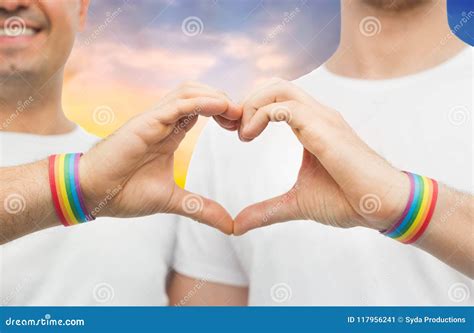 gay couple with rainbow wristbands and hand heart stock image image of marriage heart 117956241