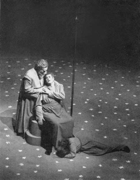 Black And White Photograph Of Two People Sitting On The Ground With Stars All Over Them