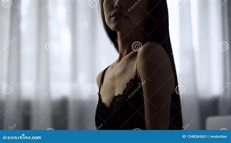 tempting woman in black lingerie flirting on bed tender and soft touches stock image image of
