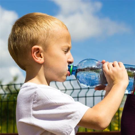 Little Thirsty Boy Child Drink Water From Bottle Stock Photo Image Of