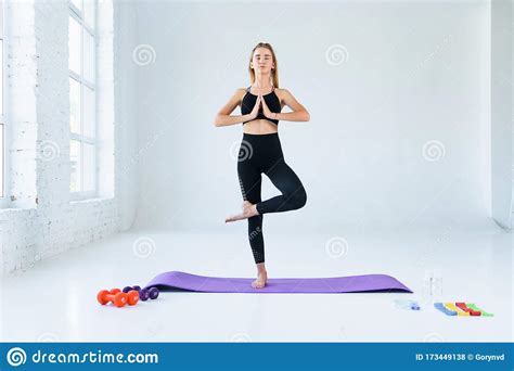 Girl Practicing Yoga Standing In Vrksasana Exercise With Namaste Tree Pose Female Meditation