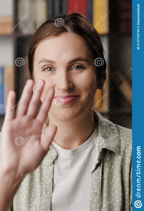 Woman Waving Hello Positive Smiling Woman In Office Or Apartment Room