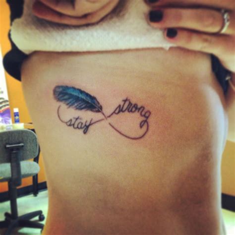 Infiniti Tattoo With Blue Jay Feather And The Words Forever In My Heart