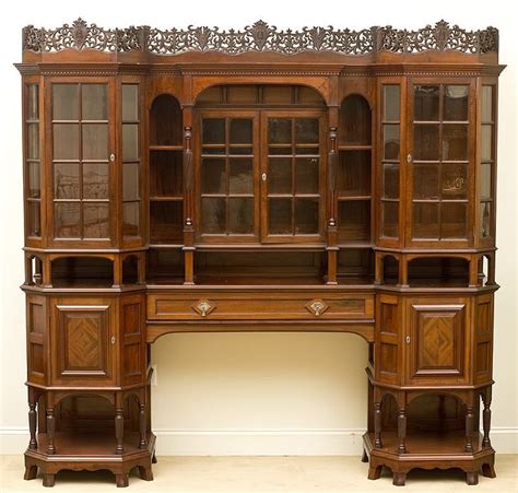 This English Metal Mounted And Carved Mahogany Display Cabinet By