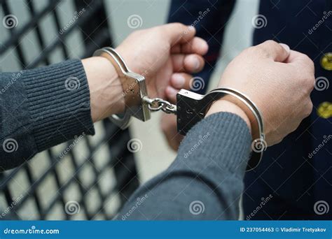A Police Officer Handcuffs A Suspect Stock Image Image Of Control Protect 237054463