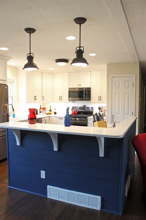 Blue kitchen cabinets with white quartz countertops. Waypoint Painted Linen Cabinets with Zodiaq Blue Carrara ...