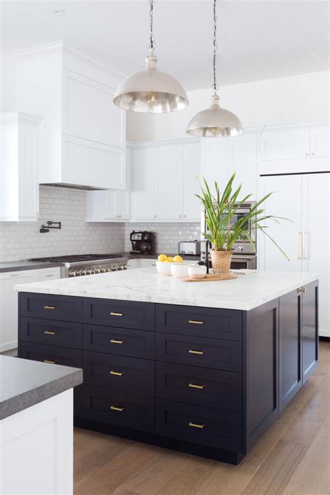 That's because white kitchen cabinets are classic, yet can go in a number of different design directions. White Chef Kitchen With Dark Blue Island | HGTV