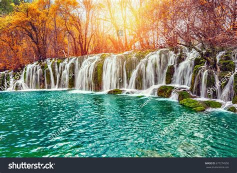 Autumn View Of The Waterfall With Pure Water At Sunrise Time