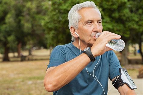 Senior Man Drinking Water L Arginine Plus