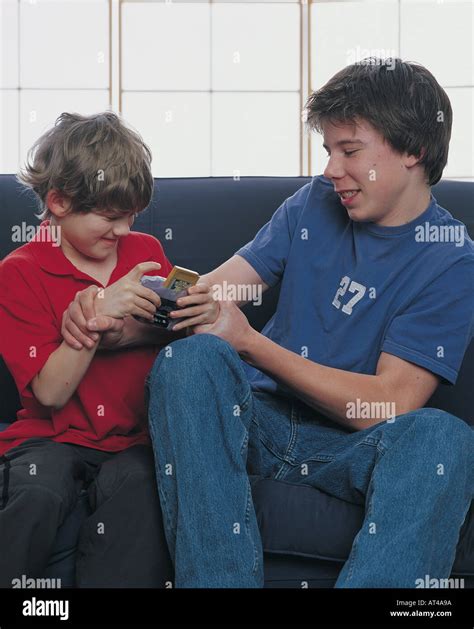 Two Boys Fighting Over A Video Game Stock Photo Alamy