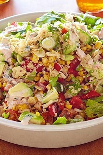 On a platter, layer the shredded lettuce, diced chicken, tomatoes, cheese, corn, avocados, green onions, cilantro and crushed chips. 16 Pioneer Woman Recipes You Can Make in 16 Minutes ...