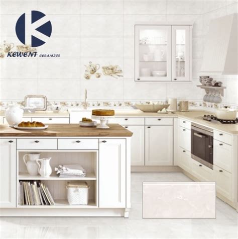 This beautiful white kitchen features thick white and gray marble countertops, which add a touch of luxury to this traditional kitchen. China 300X600 White Marble Look Glossy Surface Glazed ...