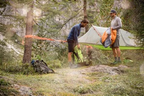 Men Preparing Hanging Tent Camping Near Forest Woods Stock Image