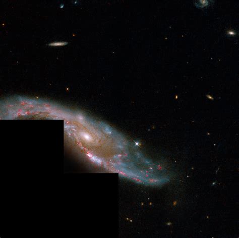Hubble Captures A Galactic Dancehubble Views An Interacting Spiral A
