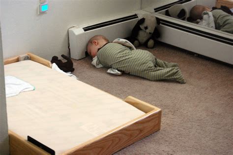 The bed itself might look pretty simple yet effectively fit to the room design. Even though baby has a Montessori floor bed, doesn't mean ...