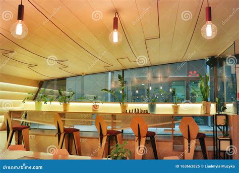 Modern Style Cafe Wooden Interior With Bar Chairs And Loft Lamps