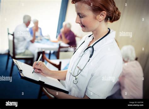 Portrait Of A Nurse With Clipboard Stock Photo Alamy